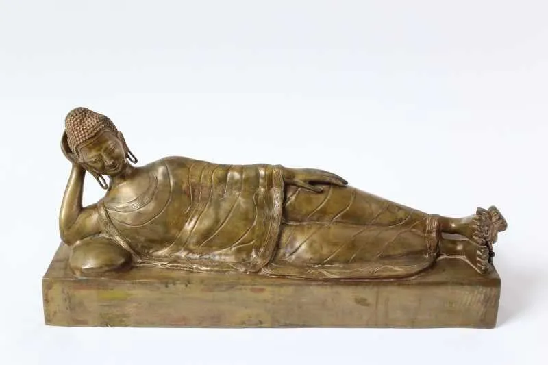Brass reclining Buddha